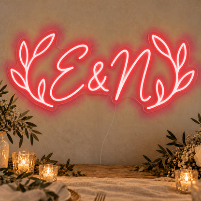 Personalised Olive Initials Neon Sign in red LED neon on clear acrylic, angled view