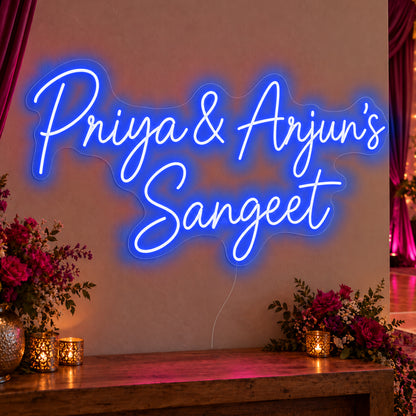 Personalised Sangeet Neon Sign in blue LED neon on clear acrylic, angled view