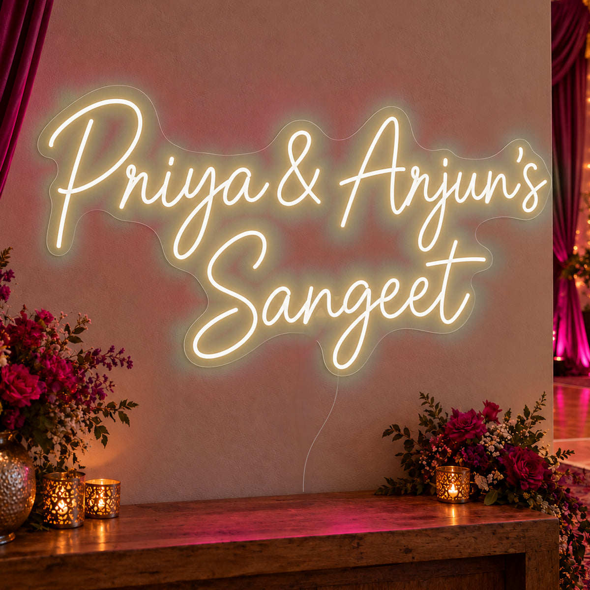 Personalised Sangeet Neon Sign in warm white LED neon on clear acrylic, angled view