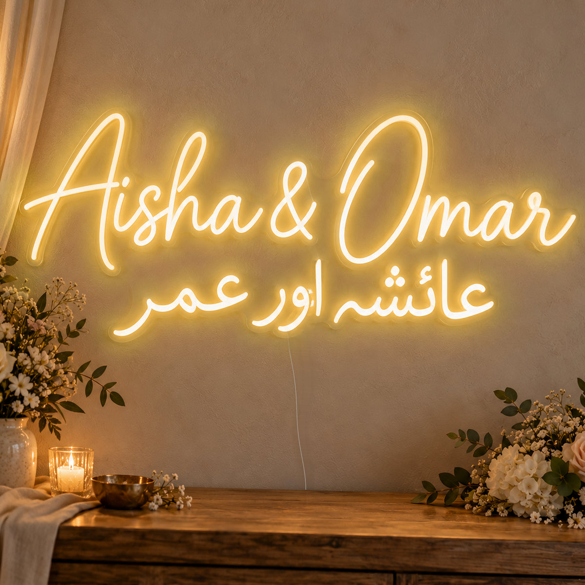 Personalised Two Script Names Neon Sign in gold LED neon on clear acrylic, angled view