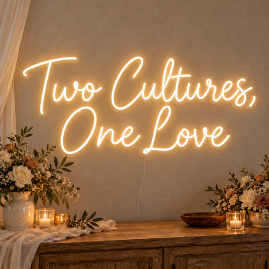 Two Cultures One Love Neon Sign on clear cut-to-shape acrylic, illuminated on a wall in a styled celebration setting